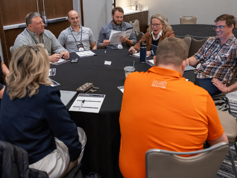 team working at table during Endless Customers Live marketing conference